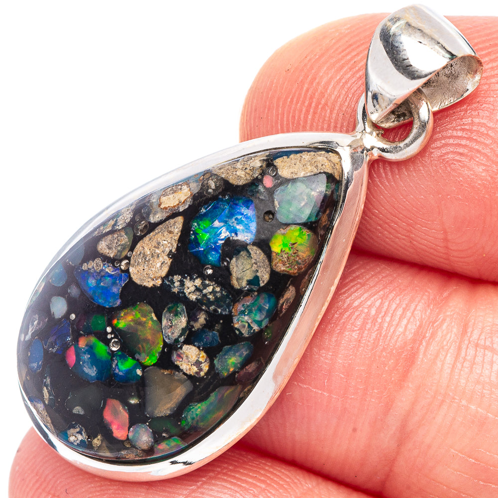 Sterling silver teardrop opal pendant with multicolor rainbow opal in dark matrix.