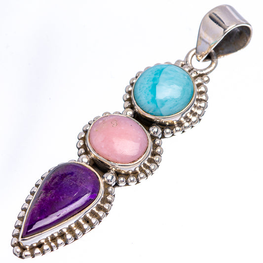 Sterling silver pendant with blue oval, pink round, and purple teardrop stones