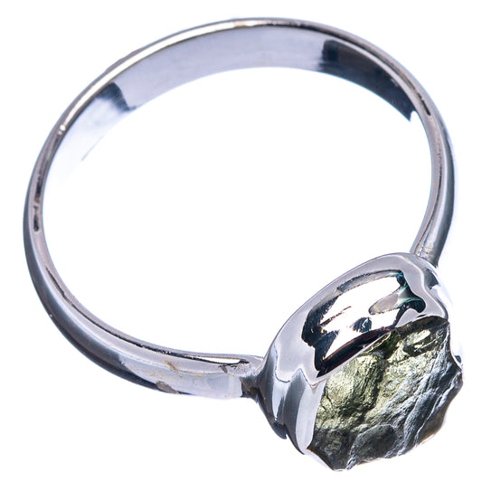 Silver ring with large rough dark green gemstone bezel, rounded band profile