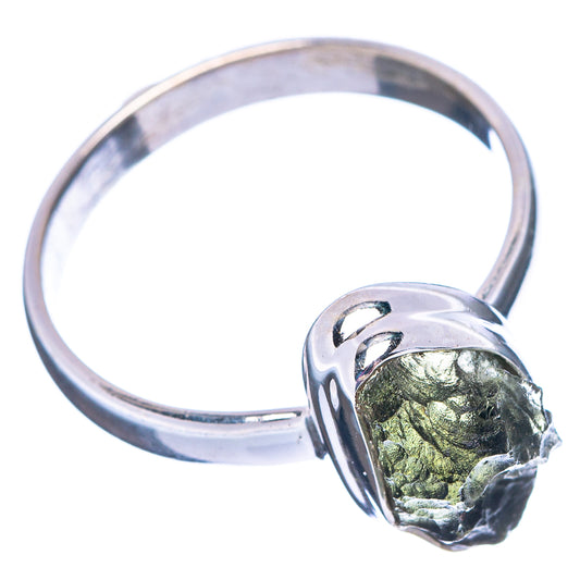 Sterling silver ring with raised green moldavite crystal in open bezel setting