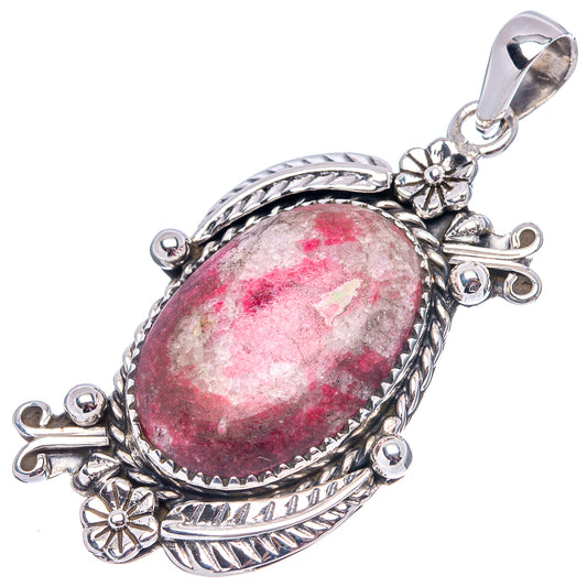 Sterling silver thulite pendant with oval pink cabochon and decorative bail top