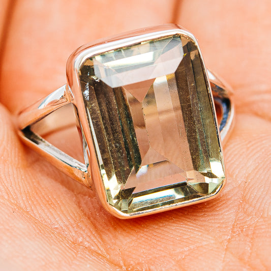 Sterling silver ring with angled view of square faceted green amethyst