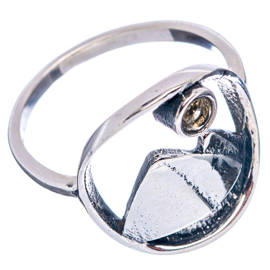 Dainty sterling silver ring showing band and citrine stone in circular bezel with mountain detail