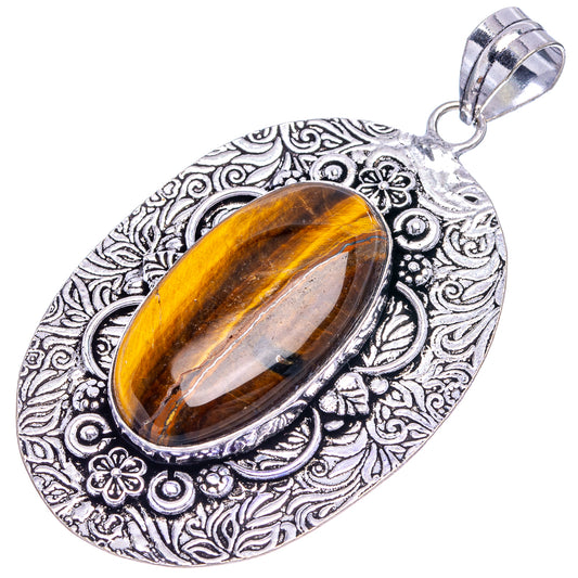 German silver tiger's eye pendant with ornate oval frame and metal bail loop