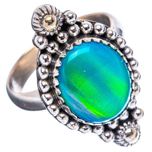 Oval opal cabochon ring in .925 sterling silver, detailed beaded halo setting