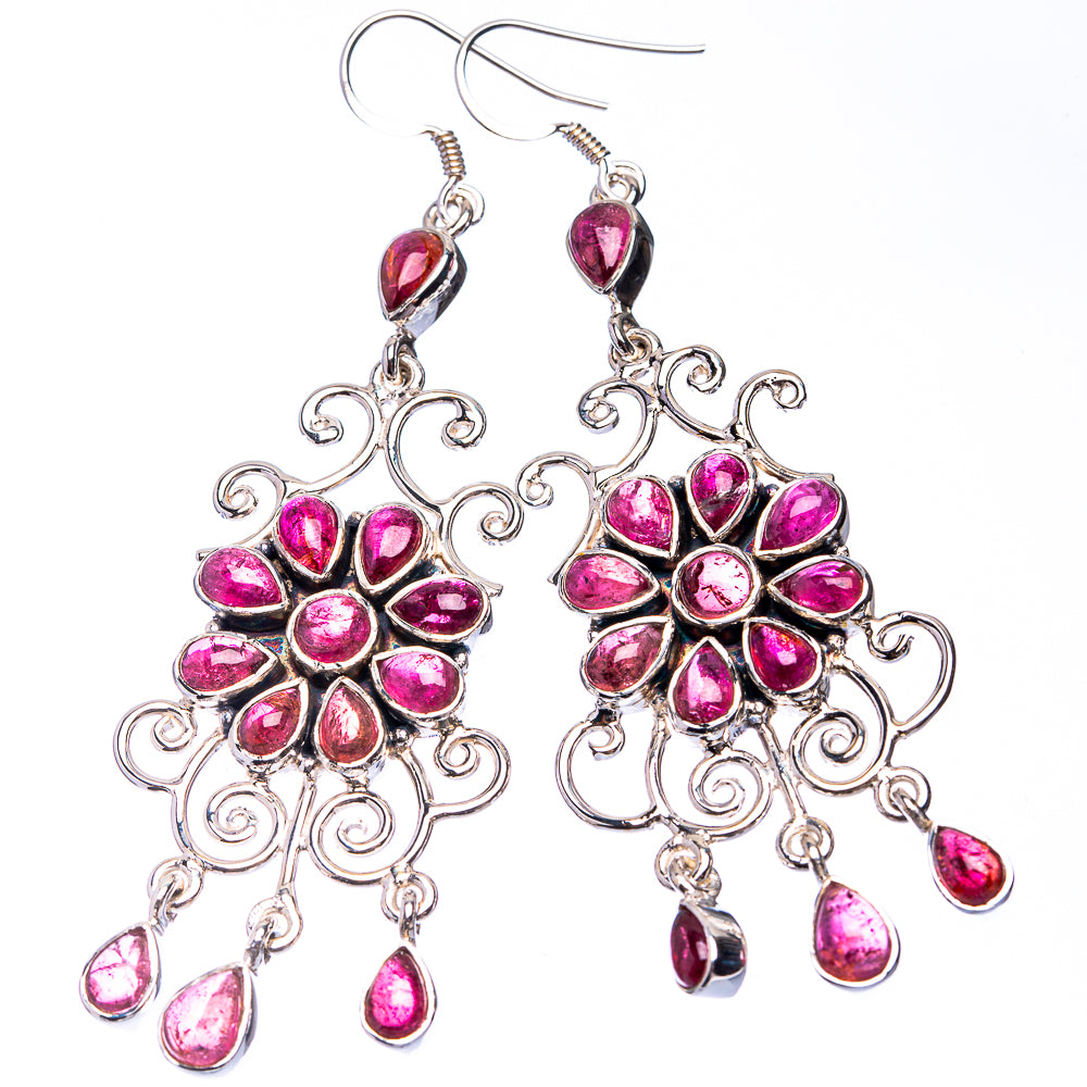Sterling silver dangling floral earrings with pink teardrop stones and ornate scrollwork