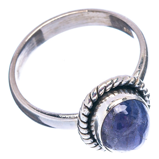 Sterling silver tanzanite ring, side view, round purple stone set in braided rope bezel