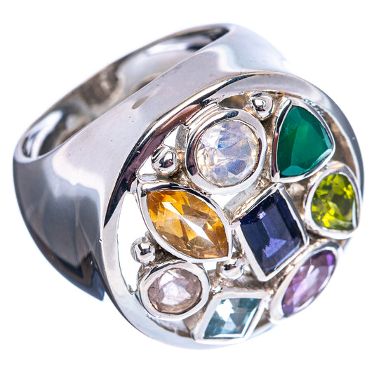 Sterling silver ring with oval light-blue stone, green and purple faceted accents, openwork