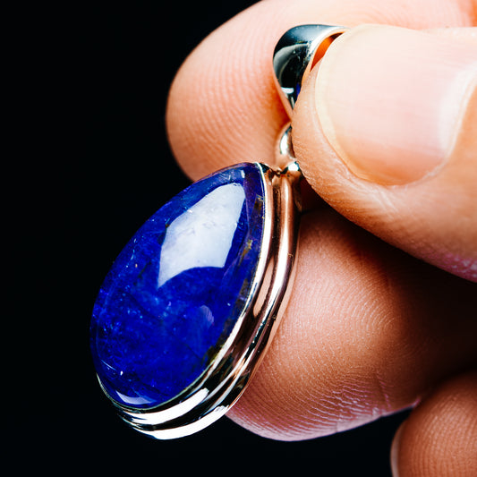Blue teardrop tanzanite pendant in .925 sterling silver, side view with bail loop