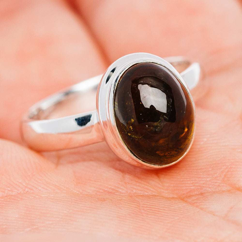 Oval dark tourmaline gemstone ring, sterling silver bezel setting on smooth band