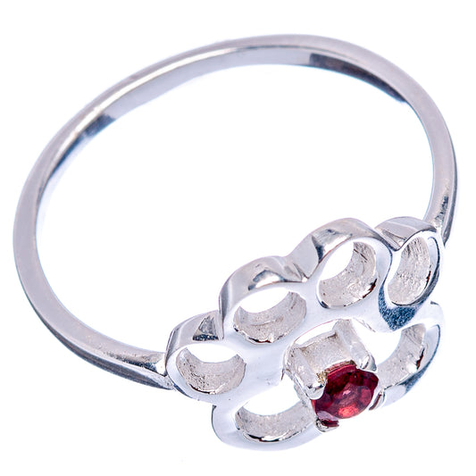 Sterling silver ring featuring paw design and red garnet stones