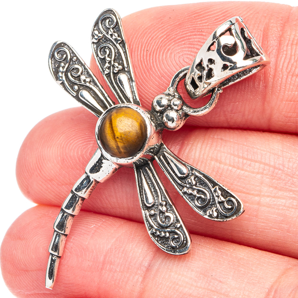 Sterling silver dragonfly pendant with tiger eye gemstone cabochon and ornate wings