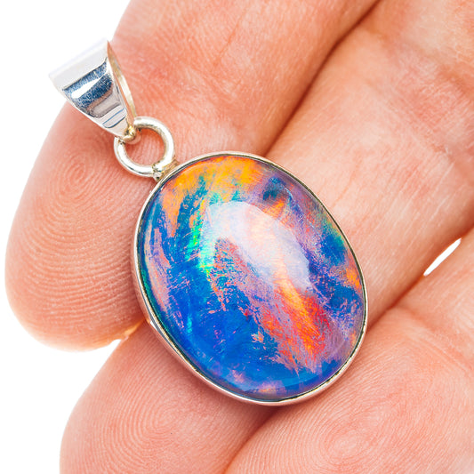 Sterling silver opal pendant with oval multicolor blue-orange opal stone in bezel