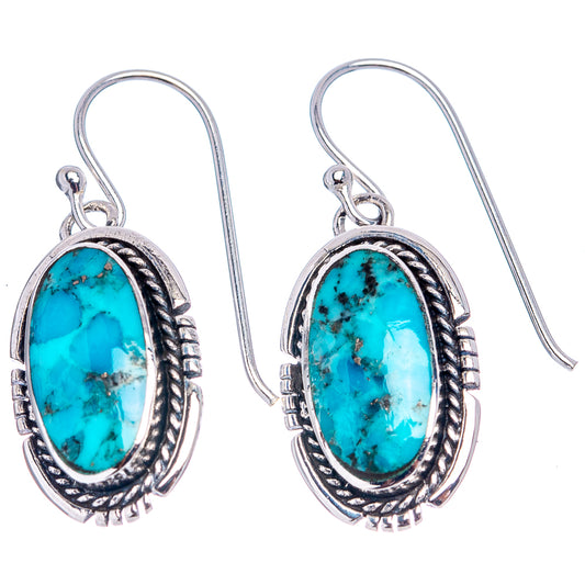 Oval turquoise stone drop earrings, oval silver bezel with rope and dot trim.