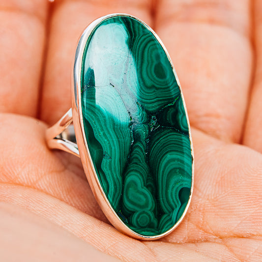 Side-view oval malachite cabochon ring, green marbled stone in silver bezel, slim band