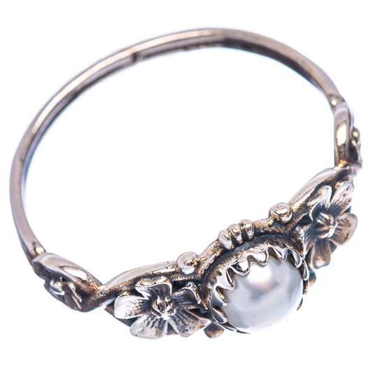 Cultured pearl ring view: round white pearl with floral setting on sterling silver band