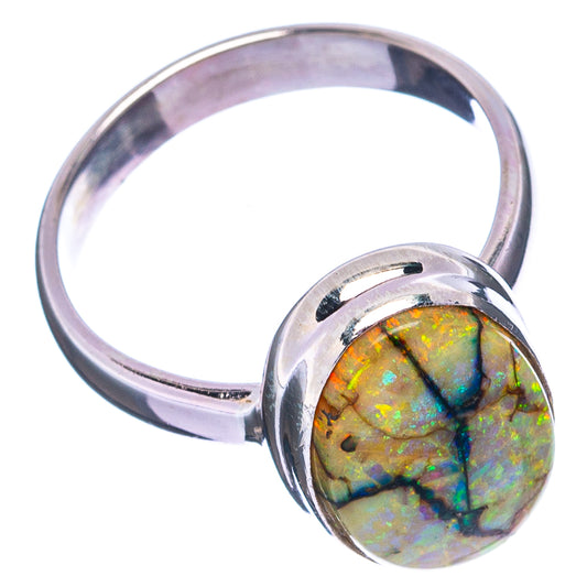 Sterling silver opal ring with iridescent oval cabochon, wide curved polished band