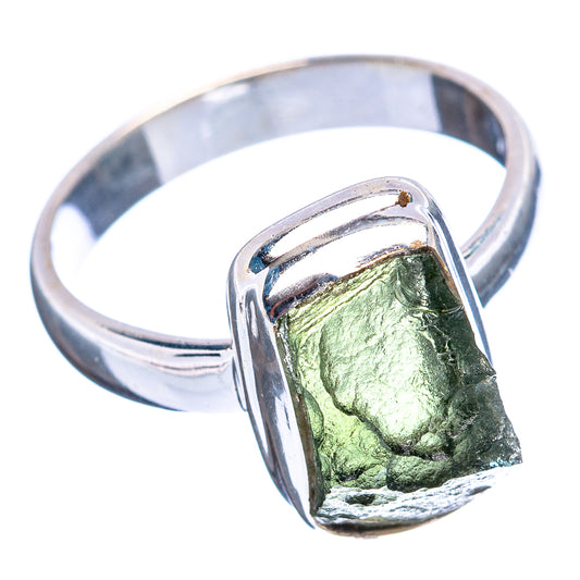 Sterling silver ring with faceted green moldavite set in raised oval bezel