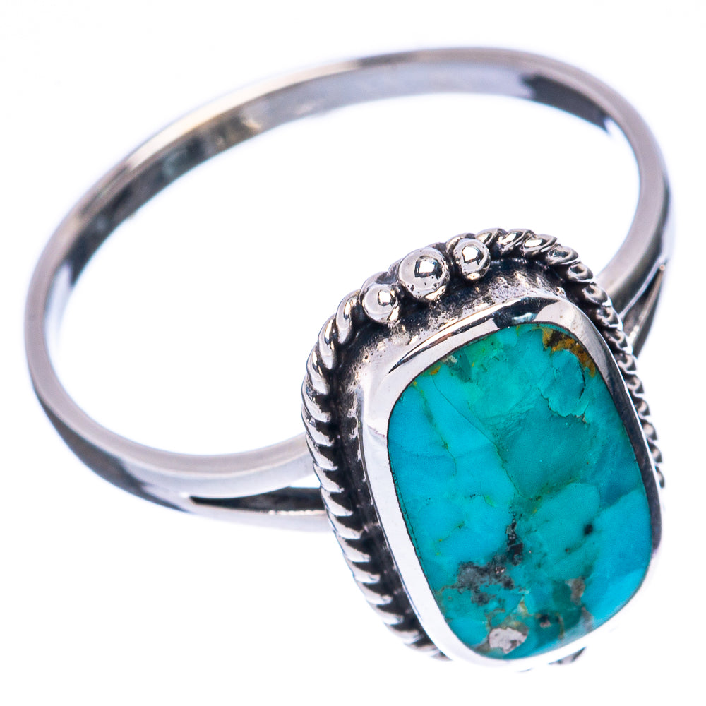 Oval turquoise cabochon sterling silver ring with raised rope-like border detail