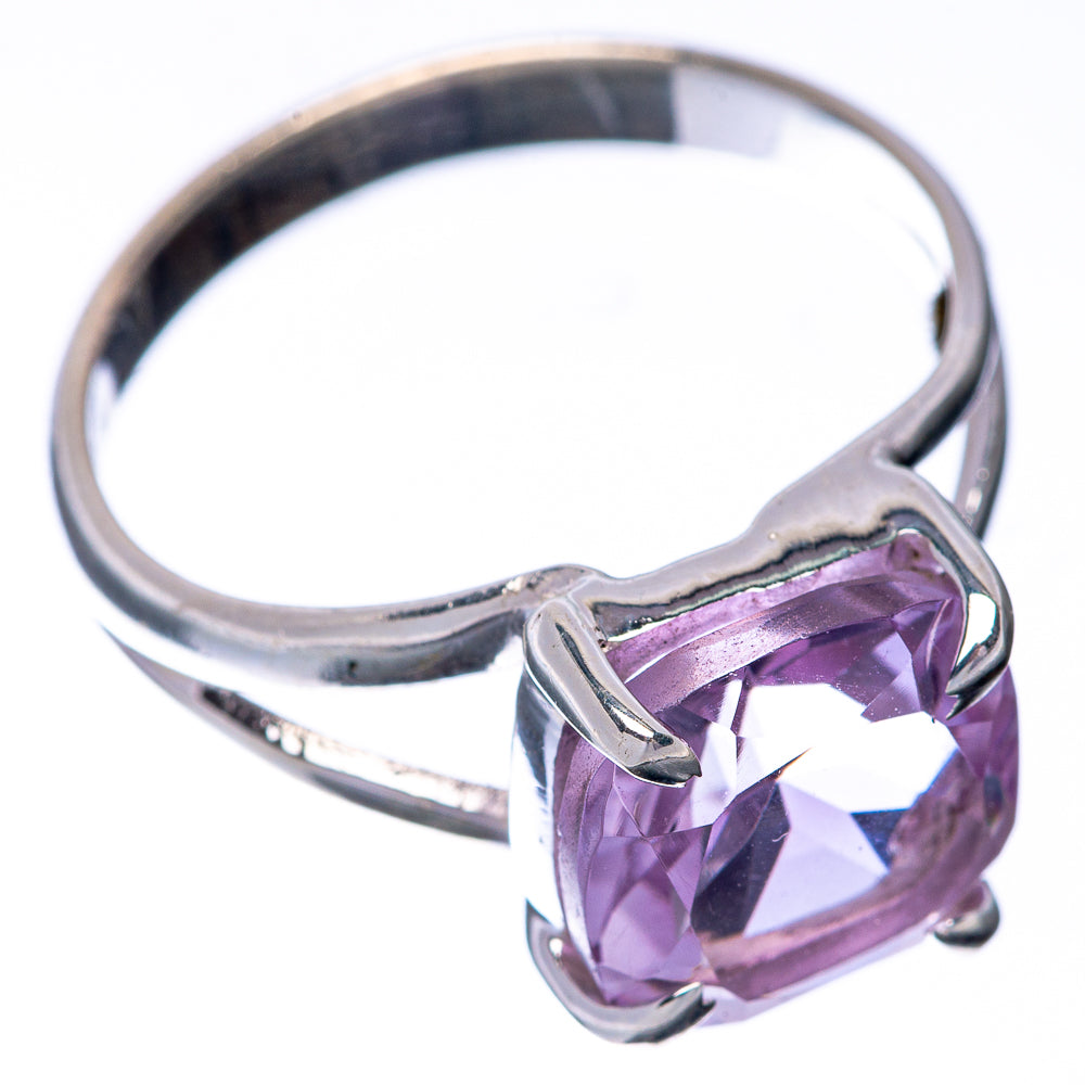 Sterling silver ring with faceted pink amethyst centerpiece and open-work setting