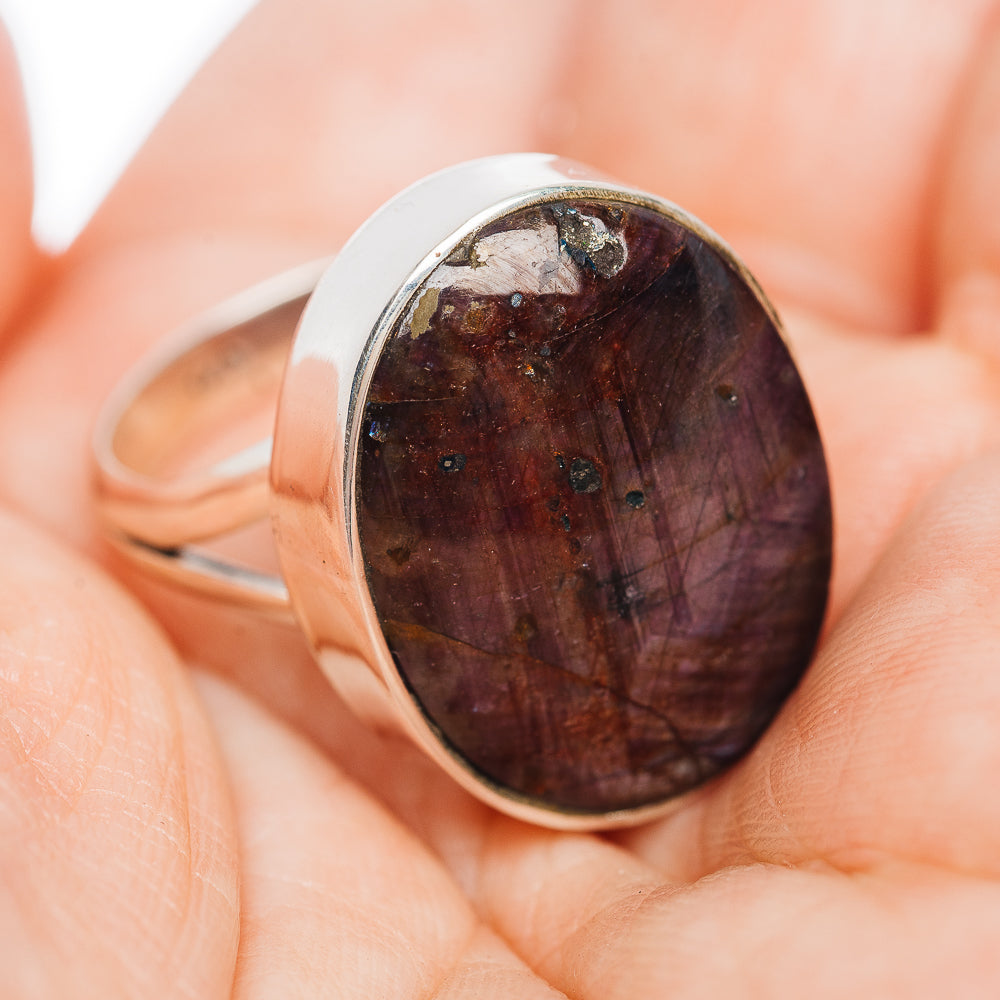 Oval dark red cabochon gemstone ring in polished sterling silver, side view