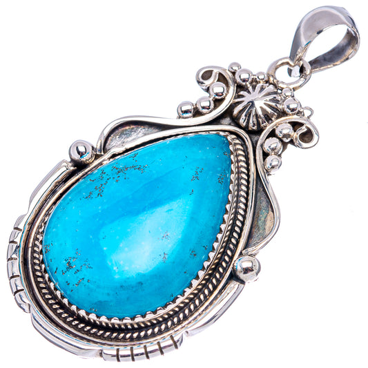 Sterling silver teardrop pendant with blue turquoise-style stone and ornate bail