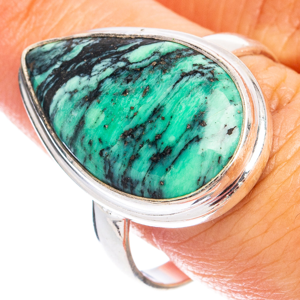 Sterling silver ring with teardrop green variscite cabochon and dark webbing.