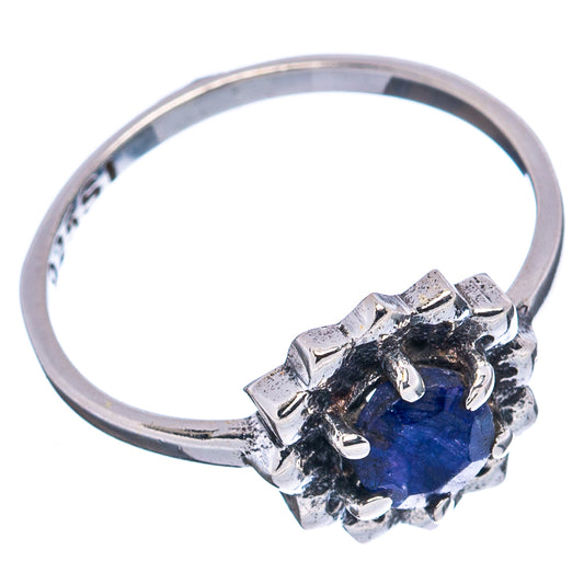 Sterling silver ring featuring a blue round gemstone on textured halo prongs