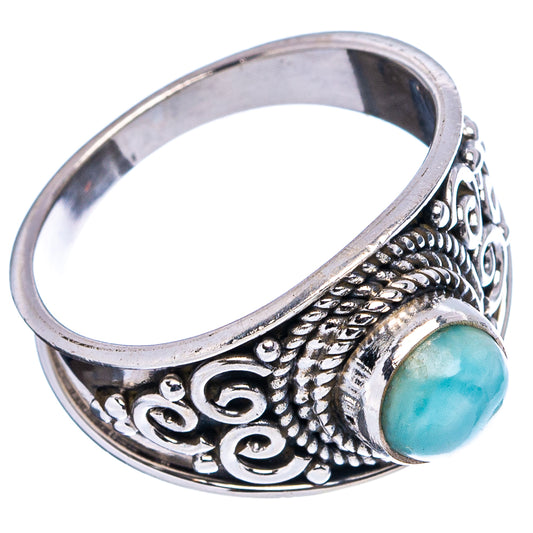 Sterling silver cocktail ring with oval aqua-blue larimar and ornate filigree band