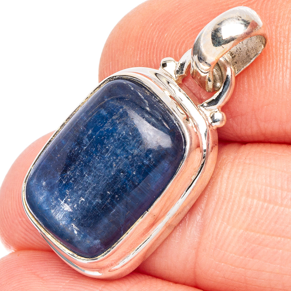 Sterling silver kyanite pendant with oval blue stone bezel and side prongs