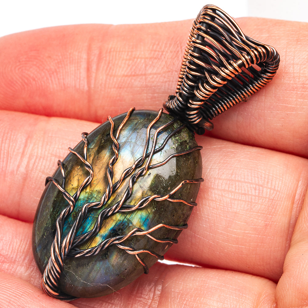 Labradorite tree of life pendant with blue-green stone in oxidized copper wire