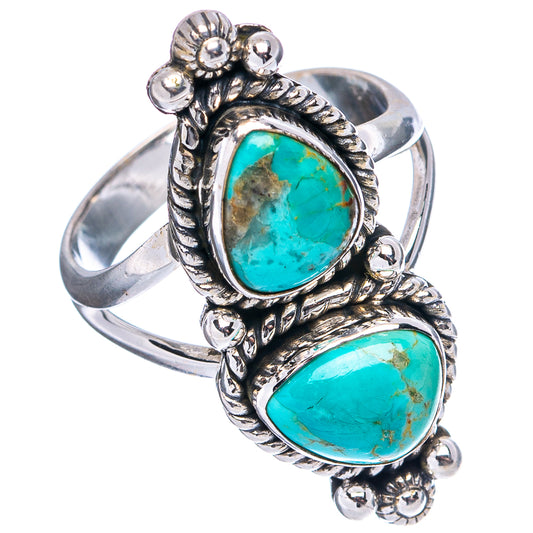 Ornate sterling silver turquoise ring with two teardrop stones in raised bezel