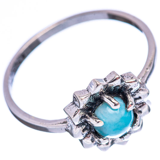 Sterling silver ring with side view of oval light-blue gemstone in raised prongs