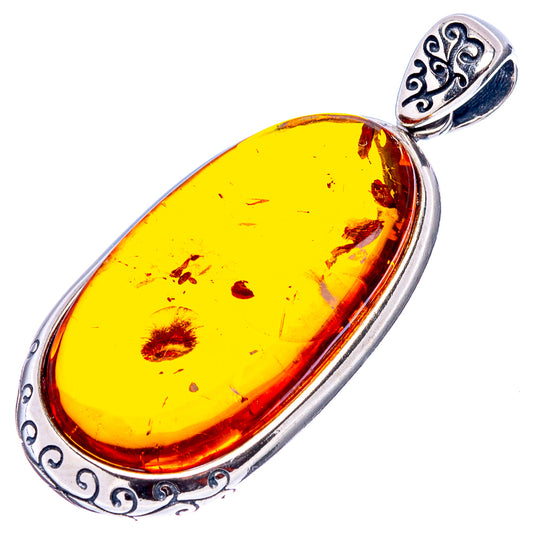 Oval yellow Baltic amber pendant in .925 sterling silver with decorative bail