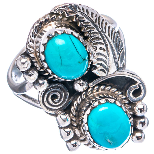 .925 sterling silver ring with two turquoise oval cabochons and leaf-like engraving