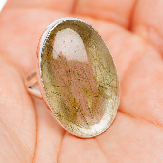 Oval rutilated quartz ring with green-gold needle inclusions, bezel in .925 sterling silver