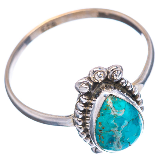 Sterling silver turquoise ring with open band, teardrop stone, and scroll details