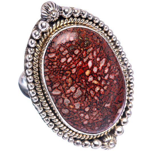 Size 10 .925 sterling silver oval dinosaur bone ring with red speckled center and bead border