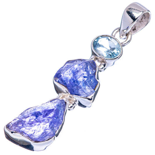 Sterling silver pendant with rough purple tanzanite and round blue topaz cabochon