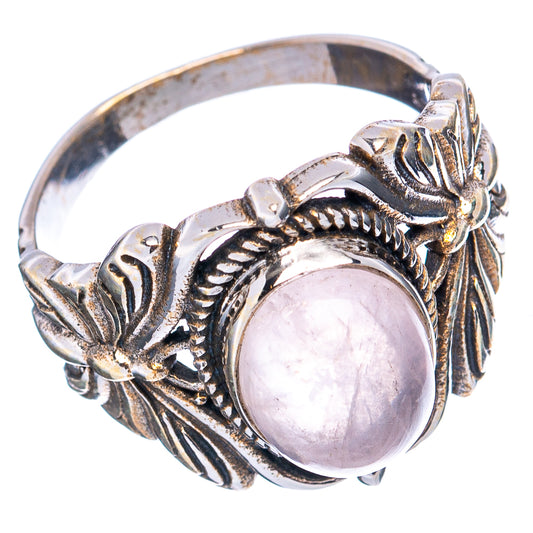 Oval rose quartz butterfly ring, detailed scrollwork and raised gemstone setting