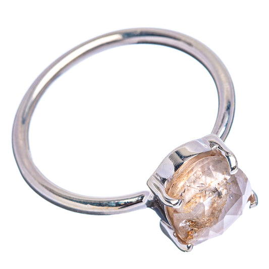 Sterling silver ring with faceted round stone, visible prongs and band profile.