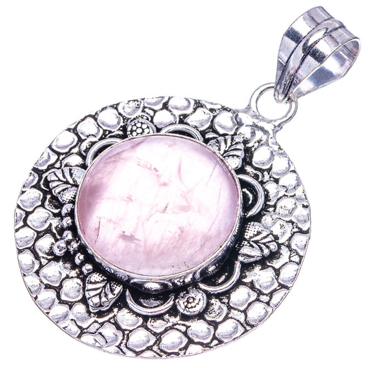 Rose quartz pendant, German silver filigree circle with pink stone cabochon and top bail