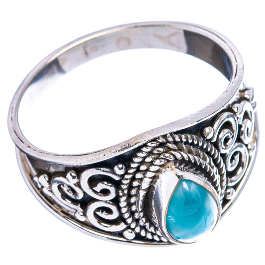 Sterling silver cocktail ring with oval blue larimar and ornate scrollwork bezel