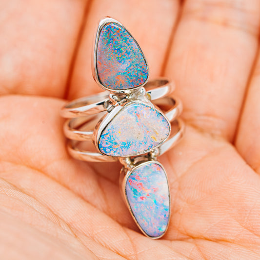 Stacked sterling silver ring with three blue fire opal teardrop stones