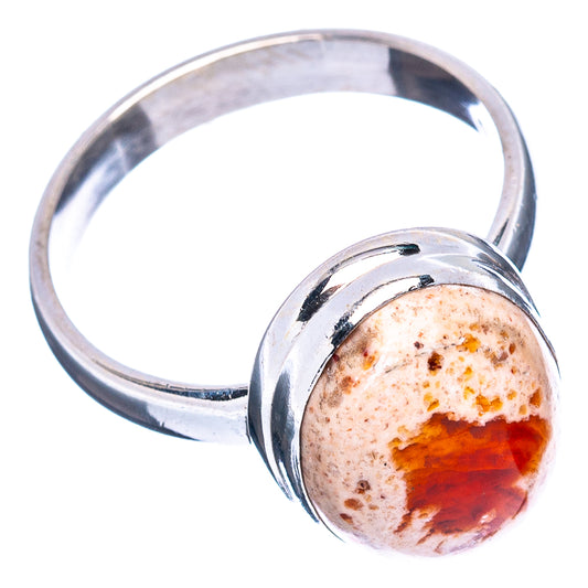 Sterling silver ring with round fire opal cabochon and polished band, orange core in stone