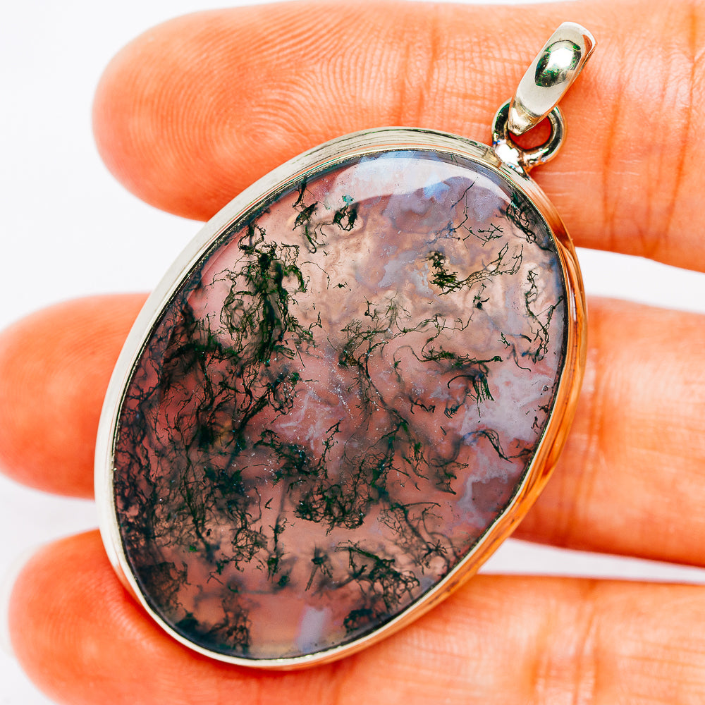 Teardrop moss agate pendant with silver-tone bezel and green gemstone bail