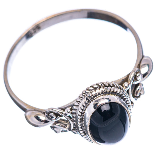 Sterling silver ring with oval black onyx stone and braided bezel, open side accents