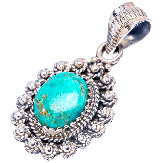 Turquoise pendant in ornate sterling silver setting with raised oval stone