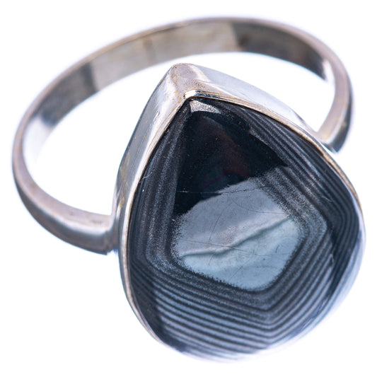 Sterling silver ring with dark blue-black striped cabochon, silver bezel and tapered band