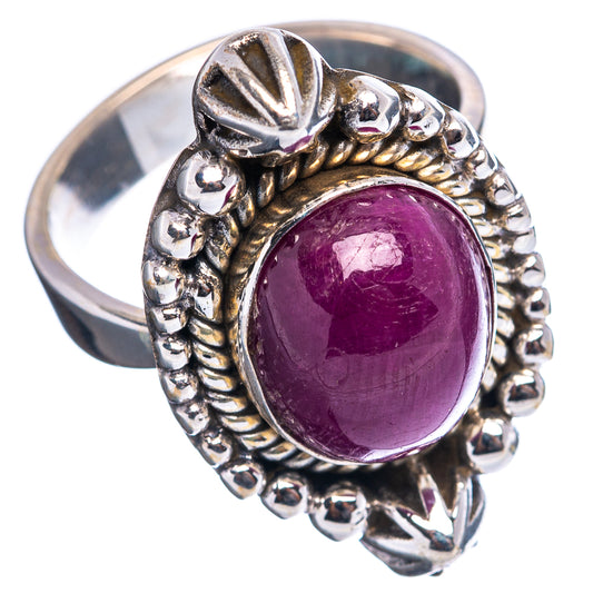 Sterling silver ring with oval purple gemstone and textured star and bead edge